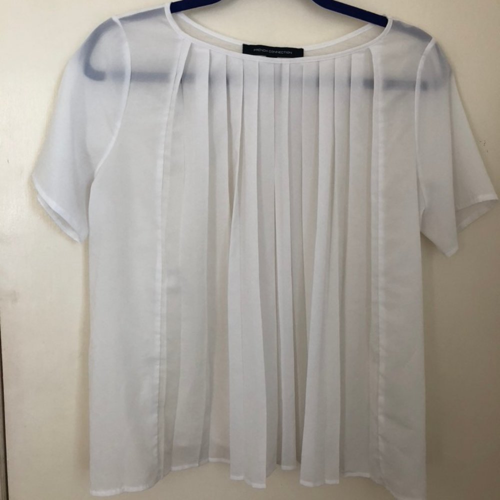 White pleated blouse